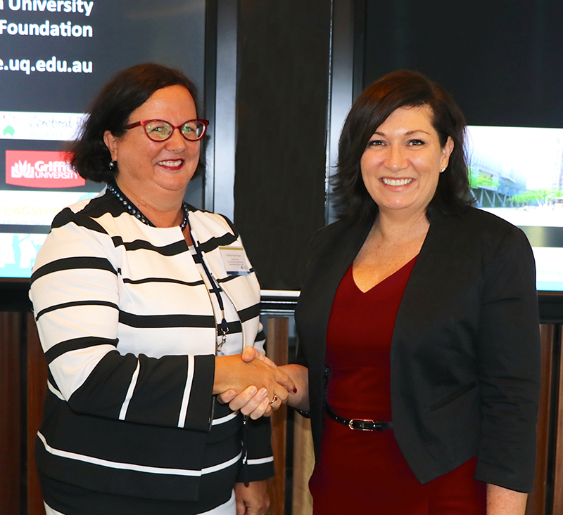 Minister Leeanne Enoch congratulates Professor Boyd