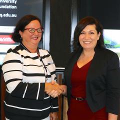 Minister Leeanne Enoch congratulates Professor Boyd